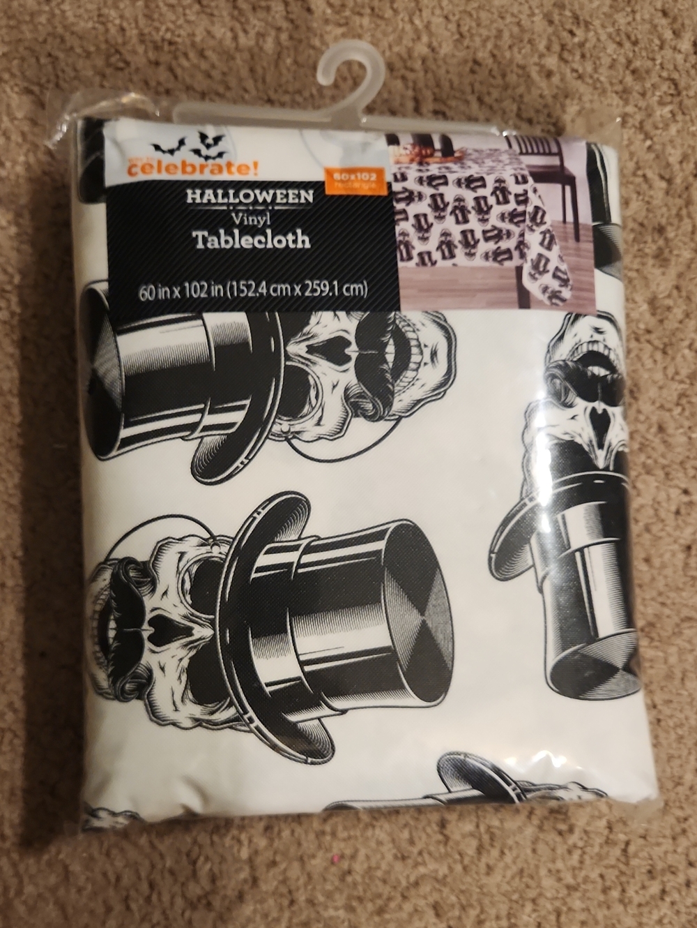Brand new Halloween Vinyl Tablecloth. White with Black Skull & Top Hat Pattern